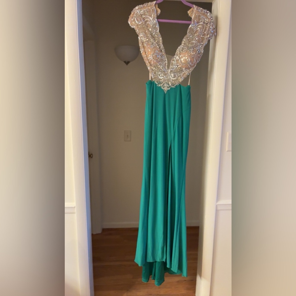 Green formal dress with sequined top and cutouts. Size 2